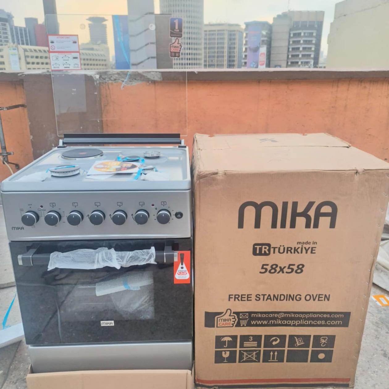 Silver Mika Standing Cooker 58 x 58 3 Gas + 1Electric Hotplate with Electric Oven